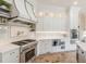 Well-equipped kitchen with a professional-grade range, custom cabinetry, and a stylish backsplash at 3718 Lake Vis, Douglasville, GA 30135