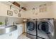 Well-organized laundry room with modern washer and dryer, sink, ample storage, and stylish decor at 3718 Lake Vis, Douglasville, GA 30135