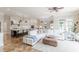 Spacious living room showcasing a modern kitchen, stylish decor, and hardwood floors at 3718 Lake Vis, Douglasville, GA 30135