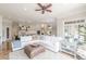 Open living room boasts a modern kitchen, comfortable seating, and lots of natural light at 3718 Lake Vis, Douglasville, GA 30135
