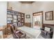 Office features built-in bookshelves, a spacious desk, and a comfortable chair, creating an inviting workspace at 3718 Lake Vis, Douglasville, GA 30135