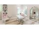 Cozy home office offers a stylish desk, built-in shelves, and sunlit windows at 3718 Lake Vis, Douglasville, GA 30135