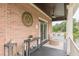 Relaxing outdoor patio featuring a porch swing, decor, and a view of the lake and surrounding nature at 3718 Lake Vis, Douglasville, GA 30135