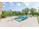 Backyard features a swimming pool, diving board and travertine patio with lake views at 3718 Lake Vis, Douglasville, GA 30135