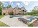 Spacious pool and patio area with modern lounge seating and manicured landscaping at 3718 Lake Vis, Douglasville, GA 30135