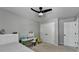 Bright bedroom features a bed, desk, and ample closet space at 595 Stonepark Ln, Suwanee, GA 30024