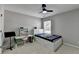 Bright bedroom featuring a single bed with under-bed storage and a desk at 595 Stonepark Ln, Suwanee, GA 30024