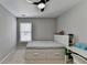 Bedroom with neutral carpet, ceiling fan, under-bed drawers and large window at 595 Stonepark Ln, Suwanee, GA 30024