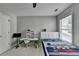 Cozy bedroom with a desk and a large window, ideal for studying and relaxing at 595 Stonepark Ln, Suwanee, GA 30024