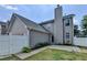 Charming home exterior featuring neutral siding, white trim, and well-maintained yard at 595 Stonepark Ln, Suwanee, GA 30024