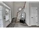 Elegant foyer with high ceilings, hardwood floors, and a staircase with wood railing at 595 Stonepark Ln, Suwanee, GA 30024