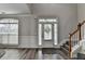 Bright foyer featuring wood floors and view of the staircase at 595 Stonepark Ln, Suwanee, GA 30024