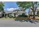Beautiful home with lush landscaping, stone accents, covered porch, and inviting curb appeal at 595 Stonepark Ln, Suwanee, GA 30024