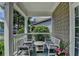Cozy front porch featuring comfortable seating and classic white railings at 595 Stonepark Ln, Suwanee, GA 30024