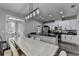 Modern open kitchen and dining area with stainless steel appliances and outdoor access at 595 Stonepark Ln, Suwanee, GA 30024