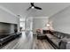 Open concept living space seamlessly connects the living room to the elegant piano room at 595 Stonepark Ln, Suwanee, GA 30024
