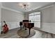 Elegant room featuring hardwood floors, piano, and large window at 595 Stonepark Ln, Suwanee, GA 30024