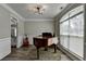 Elegant room featuring hardwood floors, piano, and wainscotting at 595 Stonepark Ln, Suwanee, GA 30024