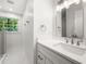 Bright bathroom features a modern vanity, sink, and large mirror at 893 Vistavia Cir, Decatur, GA 30033