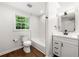Bathroom with vanity, tub/shower combo and window with natural light at 893 Vistavia Cir, Decatur, GA 30033