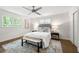 Serene bedroom with neutral tones, a comfortable bed, and plenty of natural light at 893 Vistavia Cir, Decatur, GA 30033