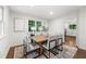 Dining room featuring a wooden table, stylish chairs, and a view of the outdoors at 893 Vistavia Cir, Decatur, GA 30033