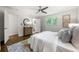 Bright and spacious main bedroom featuring hardwood floors and two windows overlooking the backyard at 893 Vistavia Cir, Decatur, GA 30033