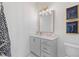 Elegant bathroom featuring modern vanity, stylish lighting, and decorative art at 989 Bibbs Circle Nw # 25, Atlanta, GA 30318