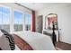 Sun-filled bedroom boasts large windows, crane-themed art, and stylish decor at 989 Bibbs Circle Nw # 25, Atlanta, GA 30318
