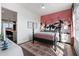 Charming bedroom with crane motif accent wall, plush rug, and abundant natural light at 989 Bibbs Circle Nw # 25, Atlanta, GA 30318