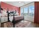 Bright bedroom featuring a crane accent wall, luxe rug, and ample natural light at 989 Bibbs Circle Nw # 25, Atlanta, GA 30318