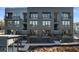 Modern, multi-story condo building featuring private balconies and brick facade in a developing community at 989 Bibbs Circle Nw # 25, Atlanta, GA 30318
