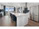 Modern kitchen open to the living area, featuring stainless steel appliances and a large island at 989 Bibbs Circle Nw # 25, Atlanta, GA 30318