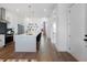 Bright and open kitchen layout with island seating and contemporary design at 989 Bibbs Circle Nw # 25, Atlanta, GA 30318