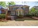 Backyard featuring a wooden deck and a lush green lawn at 1021 Oakpointe Pl, Dunwoody, GA 30338