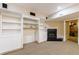 Basement featuring built in shelves and a fireplace at 1021 Oakpointe Pl, Dunwoody, GA 30338