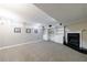 Finished basement features built-in bookshelves and a fireplace at 1021 Oakpointe Pl, Dunwoody, GA 30338