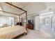 Spacious bedroom with large bed, fan, and natural light, offering a relaxing retreat at 1021 Oakpointe Pl, Dunwoody, GA 30338