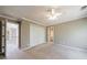 Bedroom featuring a double closet and neutral carpet at 1021 Oakpointe Pl, Dunwoody, GA 30338