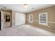 Bedroom featuring a double closet and two windows with white blinds at 1021 Oakpointe Pl, Dunwoody, GA 30338
