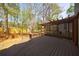 Spacious wooden deck with lattice-covered pergola overlooking the backyard at 1021 Oakpointe Pl, Dunwoody, GA 30338
