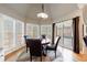 Dining nook with bay window, hardwood floors, and modern light fixture at 1021 Oakpointe Pl, Dunwoody, GA 30338