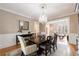 Elegant dining area with chandelier and view of the nearby living spaces at 1021 Oakpointe Pl, Dunwoody, GA 30338