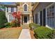 Charming home with stone accents, dark shutters, and a well-manicured lawn at 1021 Oakpointe Pl, Dunwoody, GA 30338