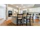 Well-appointed kitchen with granite island and breakfast bar, and plenty of cabinet space at 1021 Oakpointe Pl, Dunwoody, GA 30338