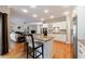 Open-concept kitchen and living room with large island, granite counters, and stainless steel appliances at 1021 Oakpointe Pl, Dunwoody, GA 30338