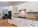 Kitchen with granite countertops, gas stovetop, wall oven, and white cabinets at 1021 Oakpointe Pl, Dunwoody, GA 30338