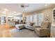 Open floor plan with kitchen, dining nook, and living room with hardwood flooring at 1021 Oakpointe Pl, Dunwoody, GA 30338