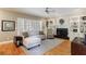 Living room featuring a fireplace, built-in shelving, and hardwood floors at 1021 Oakpointe Pl, Dunwoody, GA 30338