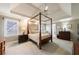 Serene main bedroom featuring a tray ceiling and neutral decor at 1021 Oakpointe Pl, Dunwoody, GA 30338